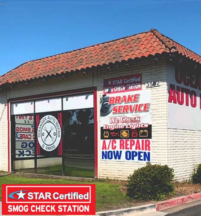The shop building with the STAR Certified smog check station sign and service banners